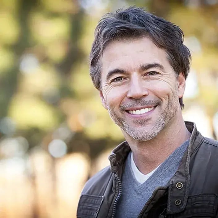 smiling-middle-aged-man-705x705