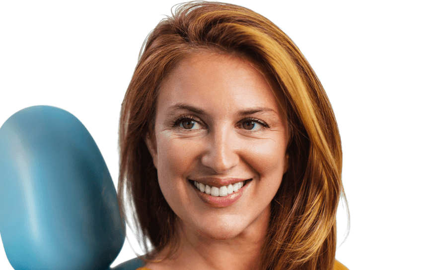woman-smiling-in-dental-chair-890x545