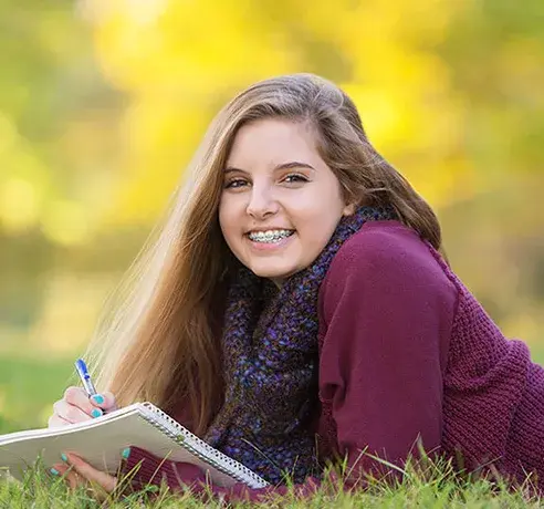 smiling-teen-with-braces-492x460